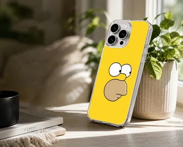 Close-up of a cartoon yellow character face with wide eyes and a prominent snout on a phone case — Lifestyle