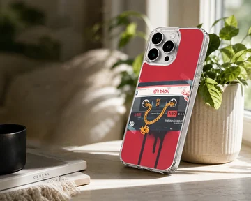 Retro cassette tape graphic with a gold chain on a red background phone case — Lifestyle