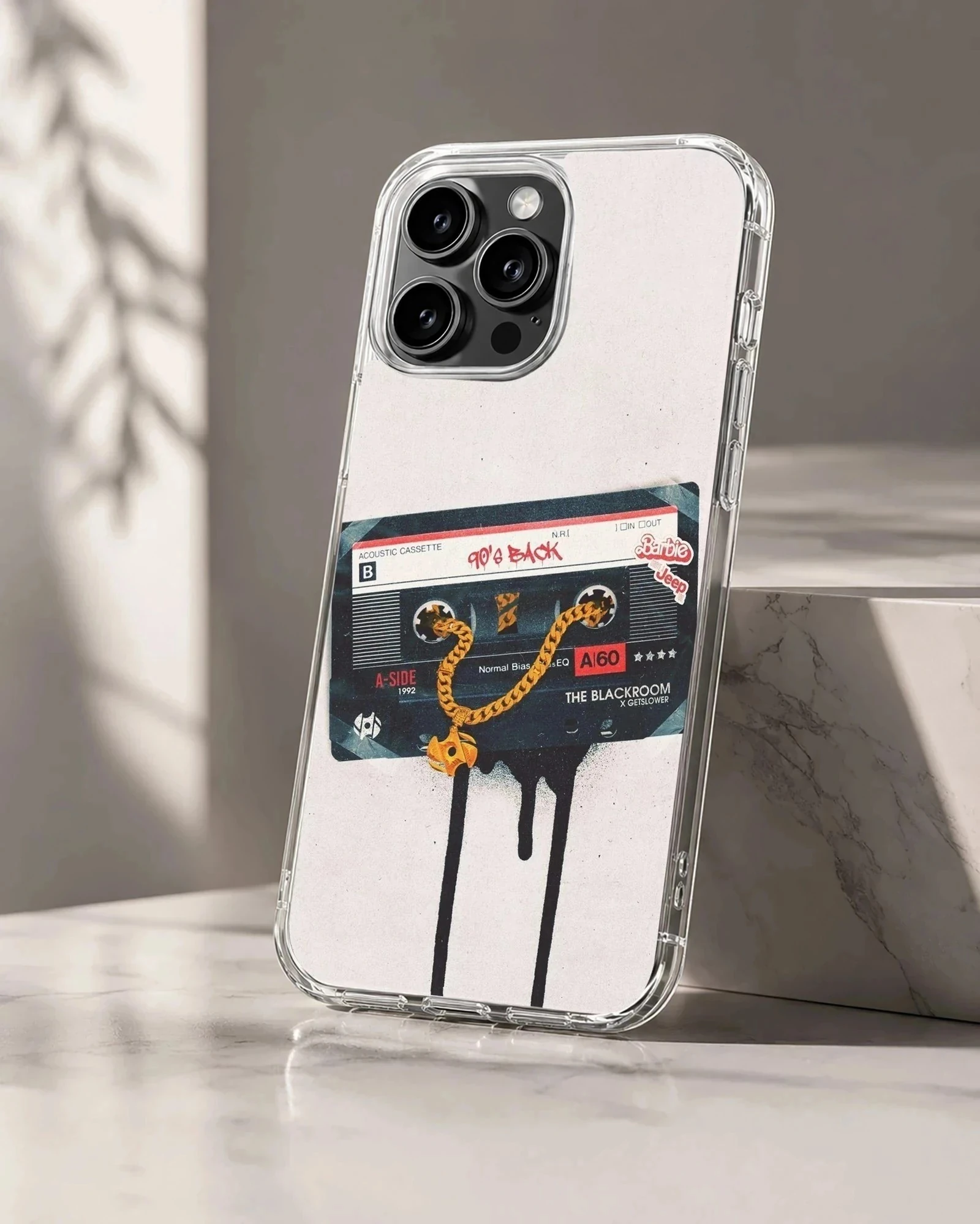 Vintage cassette tape graphic with a gold chain dripping onto a white background phone case