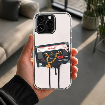 Vintage cassette tape graphic with a gold chain dripping onto a white background phone case — Lifestyle