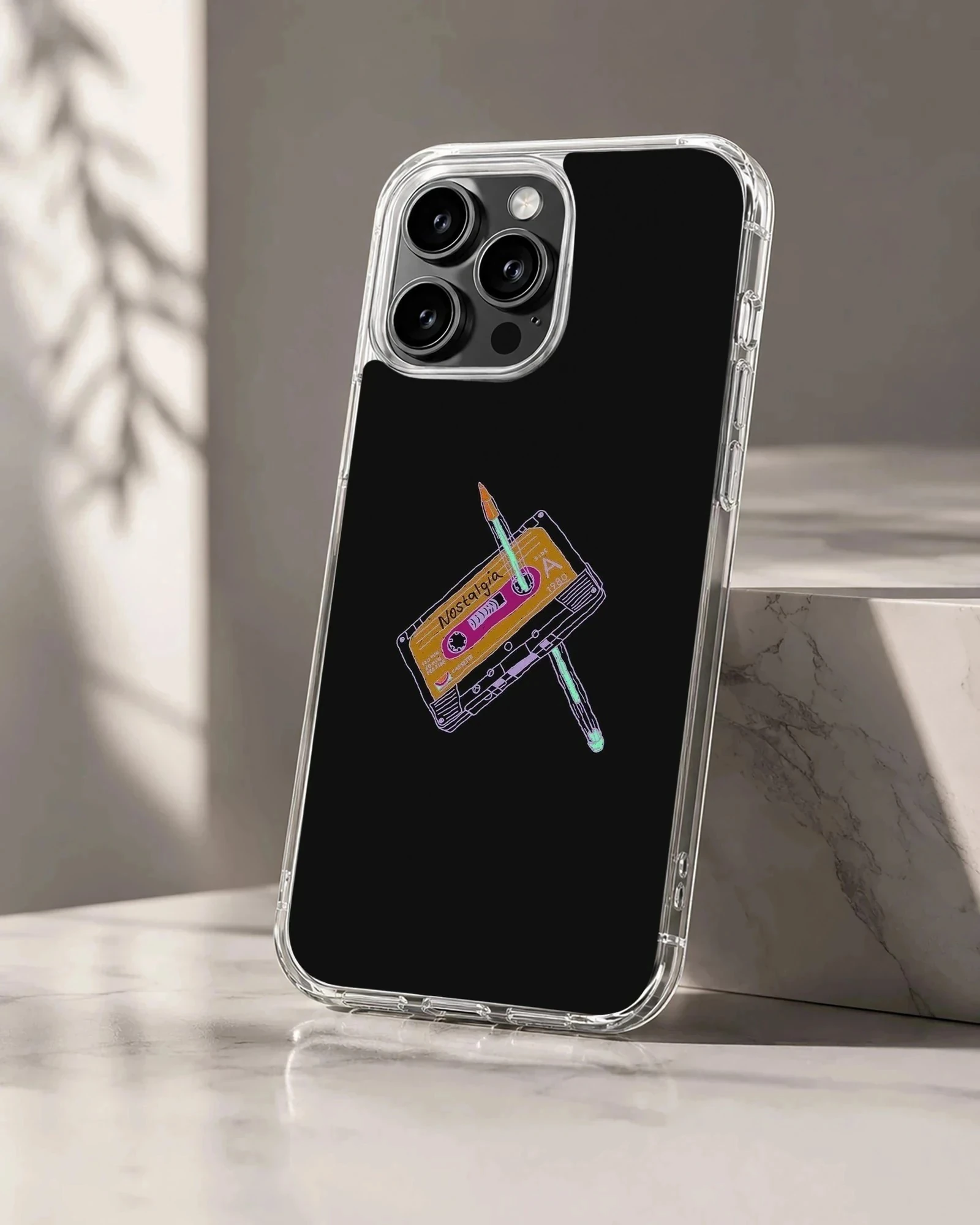 Digital illustration of an old-school cassette tape pierced with a pencil on a black phone case