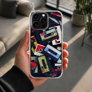 A collage of colorful vintage cassette tapes printed on a matte phone case. — Lifestyle