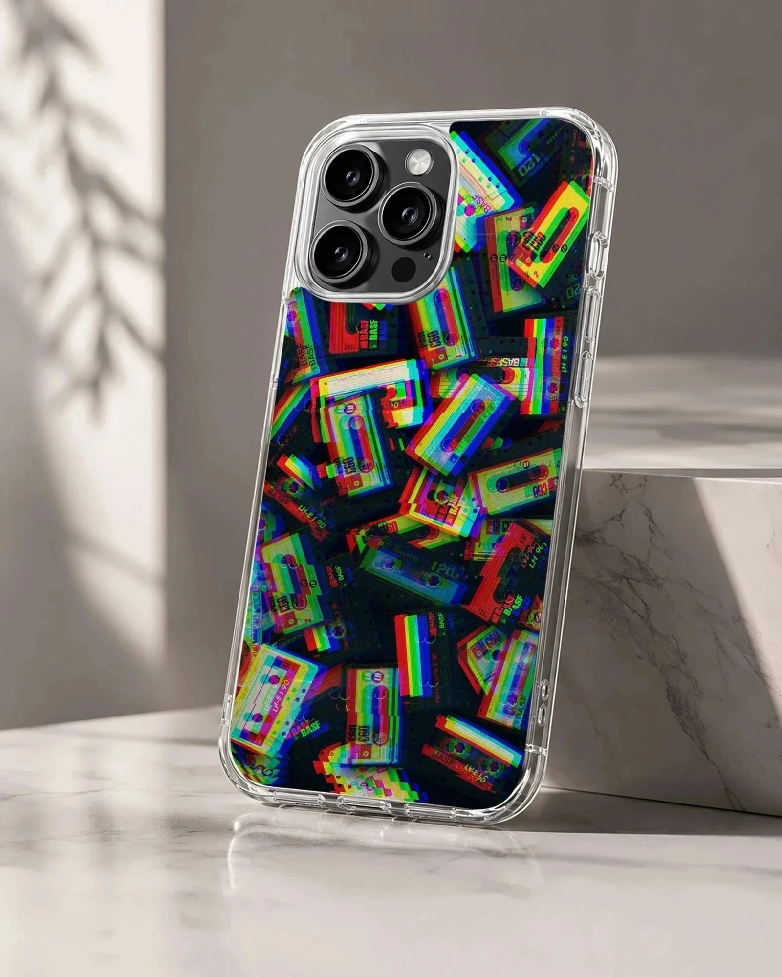 Colorful retro cassette tapes arranged in a glitch art pattern on a protective phone case