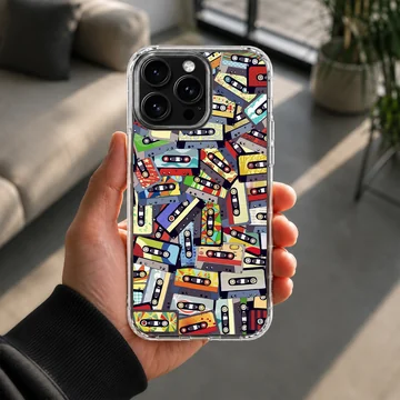An artistic collage of colorful vintage cassette tapes printed on a matte phone case — Lifestyle