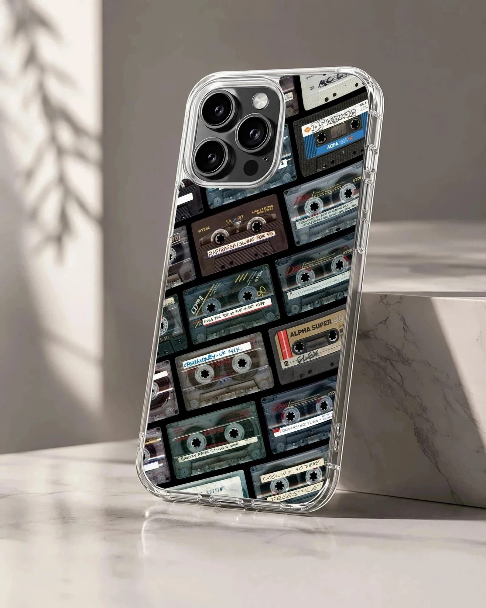 Collage of vintage cassette tapes with handwritten labels on a matte phone case