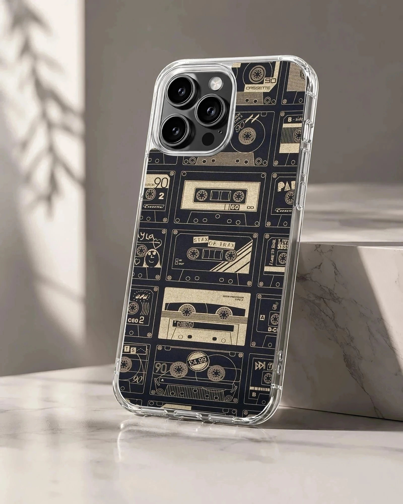 A vintage cassette tape patterned phone case featuring retro mixtapes on a dark background phone case