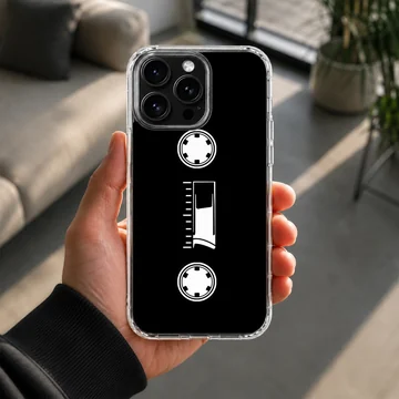 Minimalist white cassette tape graphic printed on a black phone case — Lifestyle