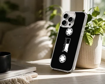 Minimalist white cassette tape graphic printed on a black phone case — Lifestyle