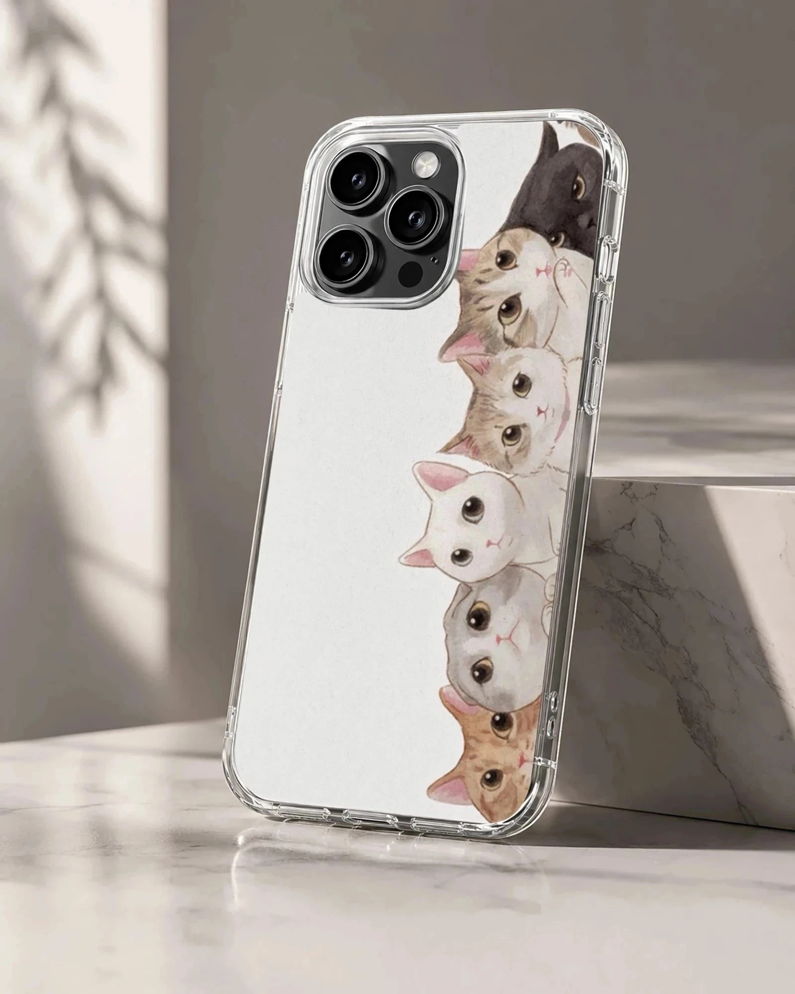 An illustration of a vertical stack of charming cats and kittens on a phone case