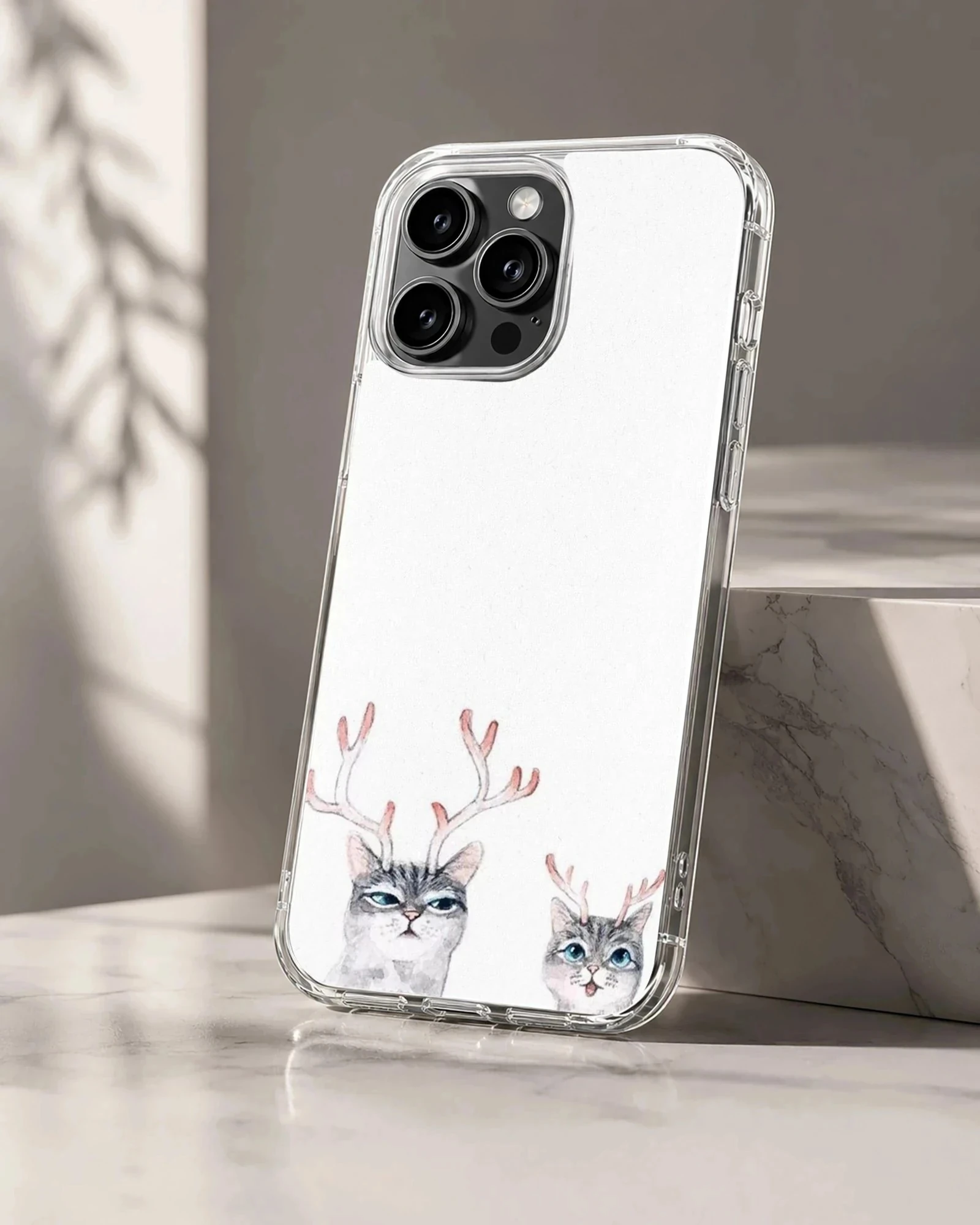 Two illustrated gray tabby cats wearing delicate pink reindeer antlers on a crisp white background phone case
