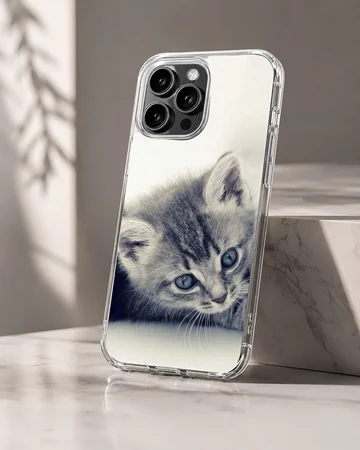 Close-up black and white photography of a sleepy tabby kitten with soft whiskers on a phone case — Hero