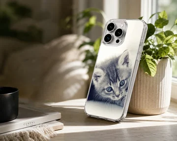 Close-up black and white photography of a sleepy tabby kitten with soft whiskers on a phone case — Lifestyle