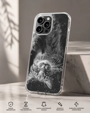 Black and white photographic print of a fluffy cat looking upside down on a phone case — Specs