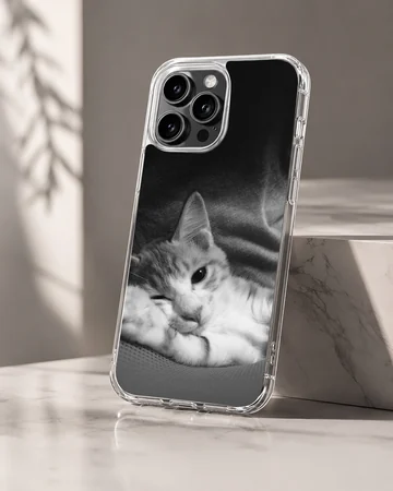 Monochrome photographic print of a sleepy resting cat on a matte phone case — Hero