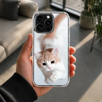 Close-up photographic print of a ginger and white kitten looking up with cute paws on a phone case — Lifestyle