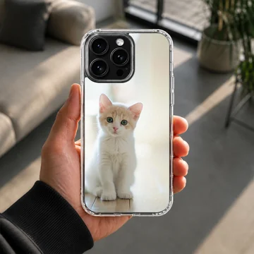 Close-up photographic print of a small white and ginger kitten sitting attentively on a light floor for a phone case — Lifestyle
