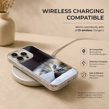 A fluffy kitten with striking blue eyes peeking from under a white blanket on a phone case — Charging