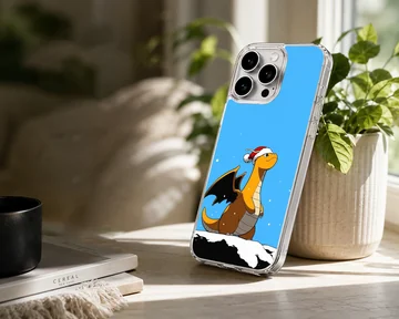 An orange cartoon dragon wearing a Santa hat stands in the snow against a bright blue sky on a phone case — Lifestyle