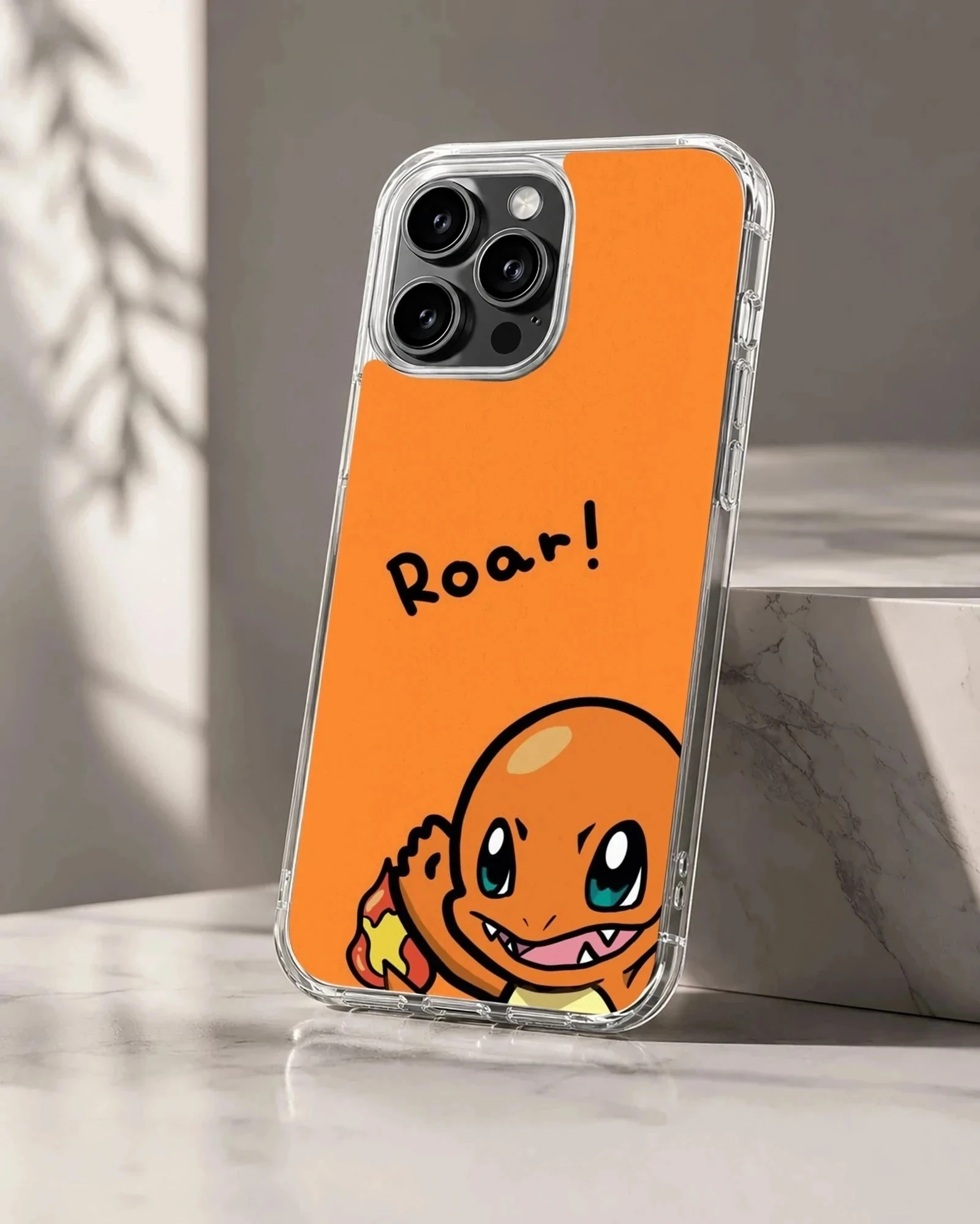 Charizard cartoon character with a roar text bubble on an orange phone case