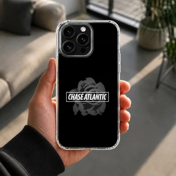 Chase Atlantic band typography over a muted rose motif on a black background phone case — Lifestyle