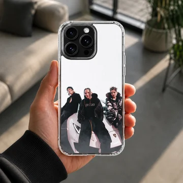 Chase Atlantic band members posing with a supercar phone case — Lifestyle
