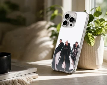 Chase Atlantic band members posing with a supercar phone case — Lifestyle