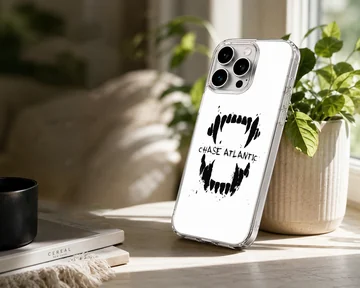 Chase Atlantic phone case featuring a bold black graphic of sharp teeth and distressed lettering on a white background — Lifestyle