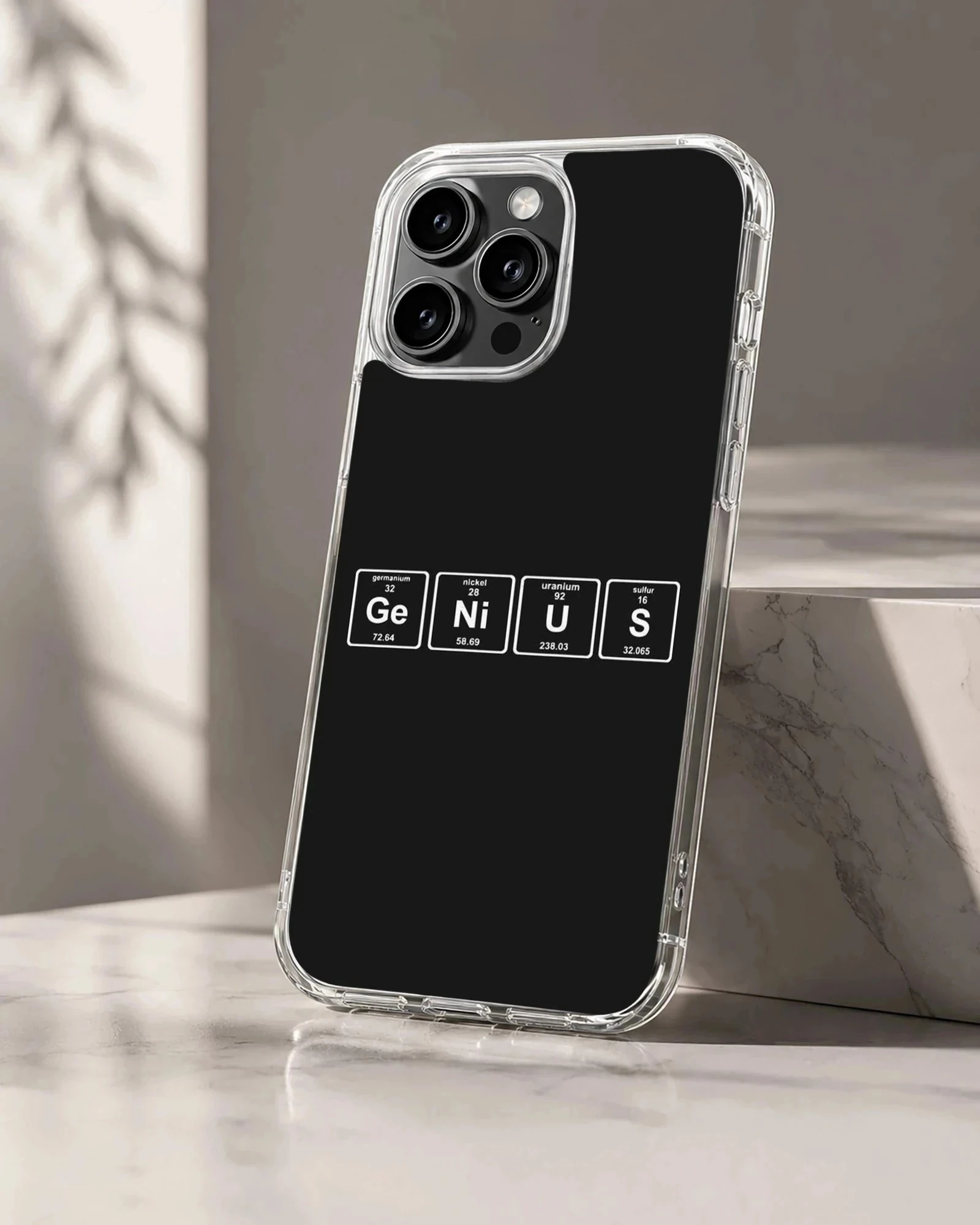 A minimalist science phone case featuring periodic table element tiles spelling out a chemistry pun against a solid dark background.