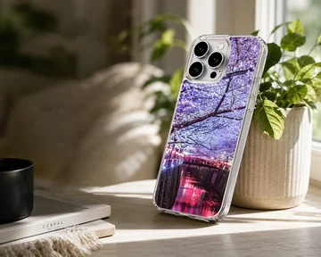 Photographic print of cherry blossoms over a glowing night river on a phone case — Lifestyle