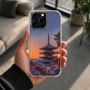 Chinese temple pagoda silhouetted against a vibrant sunset sky on a phone case — Lifestyle