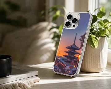 Chinese temple pagoda silhouetted against a vibrant sunset sky on a phone case — Lifestyle