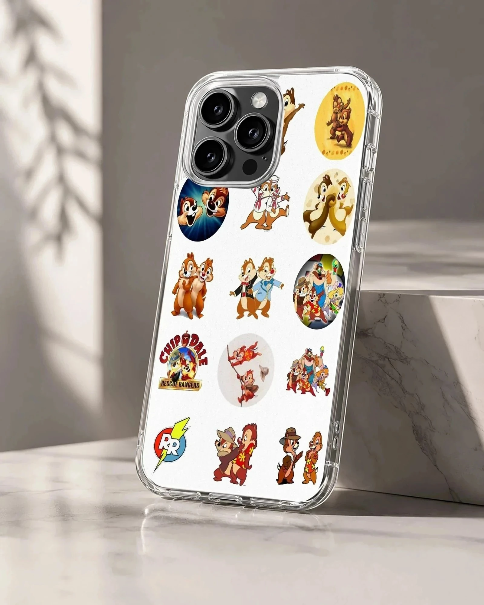 Collage of classic Chip and Dale cartoon stickers on a white phone case
