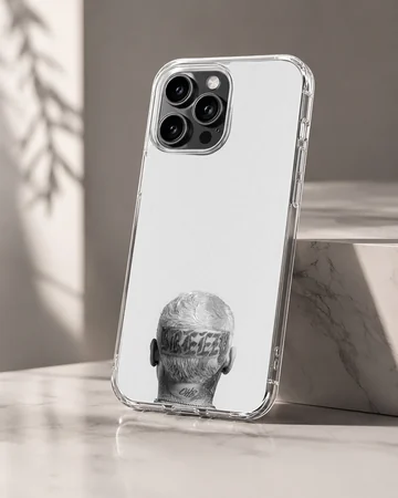 Monochrome photographic print of the back of a head with tattoos and neck lettering on a phone case — Hero
