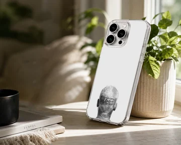 Monochrome photographic print of the back of a head with tattoos and neck lettering on a phone case — Lifestyle