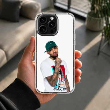 Chris Brown wearing a green cap and graphic t-shirt phone case — Lifestyle