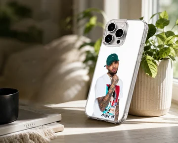 Chris Brown wearing a green cap and graphic t-shirt phone case — Lifestyle