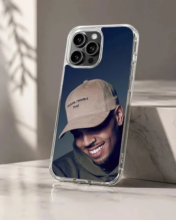 Chris Brown smiling portrait wearing a beige cap phone case