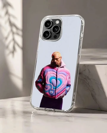 Chris Brown in a colorful pink and blue heart puffer jacket on a phone case