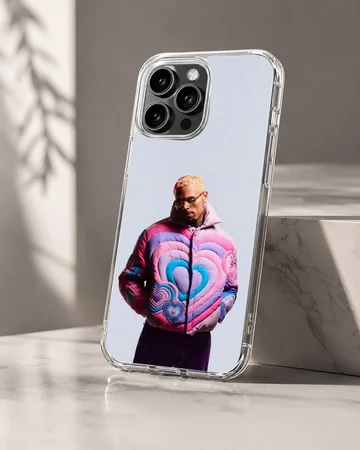 Chris Brown in a colorful pink and blue heart puffer jacket on a phone case — Hero