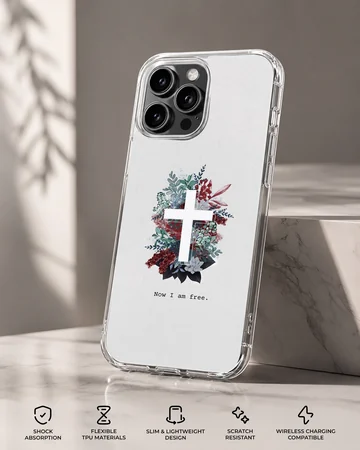 White phone case featuring a white cross centered in a lush arrangement of red, blue, and green foliage with the words Now I am free underneath. — Specs