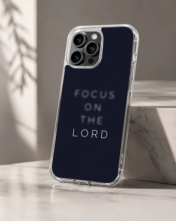 Dark navy phone case with minimalist typography reading Focus on the Lord phone case — Hero