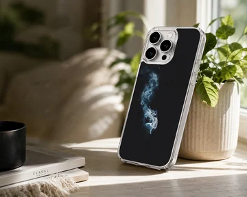 A close-up of a slim phone case featuring delicate wisps of white and blue smoke against a solid black background phone case — Lifestyle