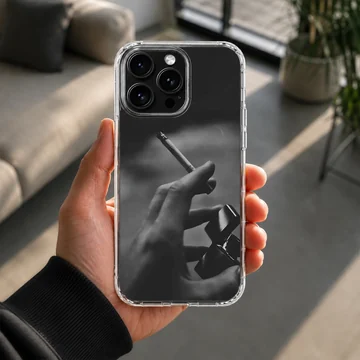 Monochrome photographic print of a hand holding a cigarette and a lighter on a phone case — Lifestyle