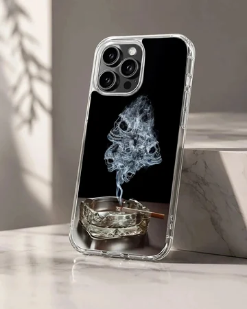 A dark phone case design featuring wisps of smoke forming skulls rising from an ashtray phone case