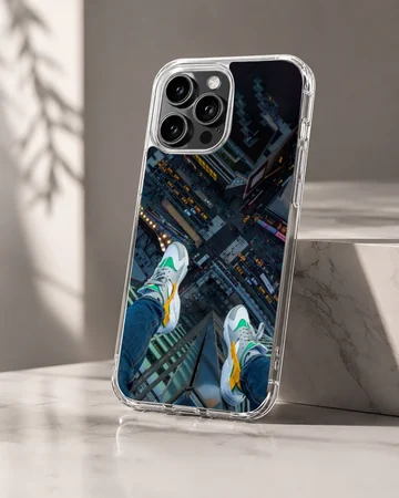 Overhead view of sneakers dangling above a city street on a phone case — Hero