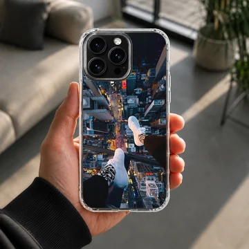 City View photograph of dangling feet overlooking a glowing urban metropolis from a high vantage point phone case — Lifestyle