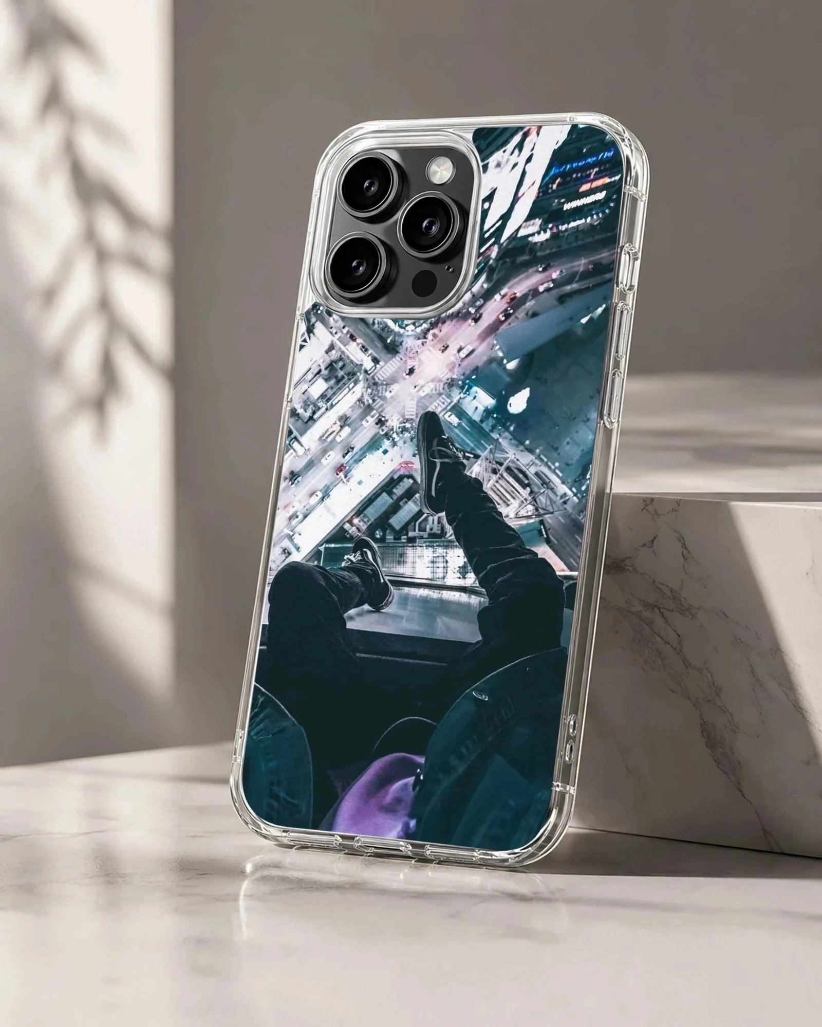 Urban rooftop view looking down at city lights and streets on a phone case