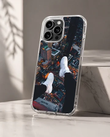 Overhead view of city skyline with dangling white sneakers over lit streets phone case — Hero