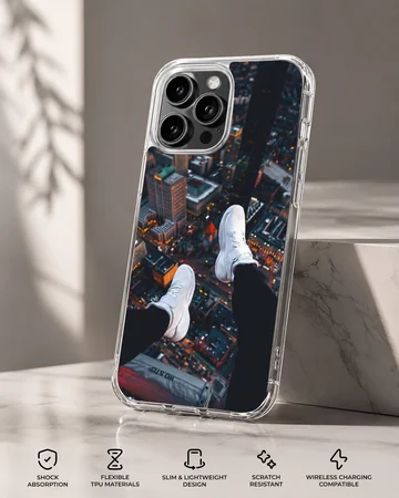Overhead view of city skyline with dangling white sneakers over lit streets phone case — Specs