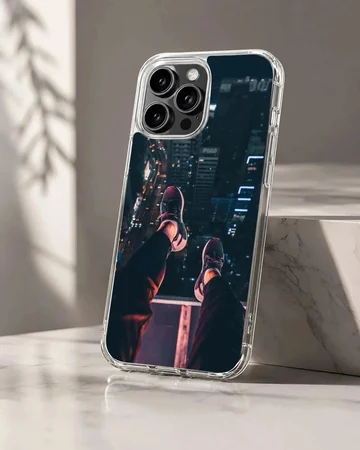 Urban photography of dangling legs overlooking a city at night on a phone case